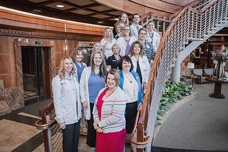 Photo of Huntsman at Home staff standing on stairs